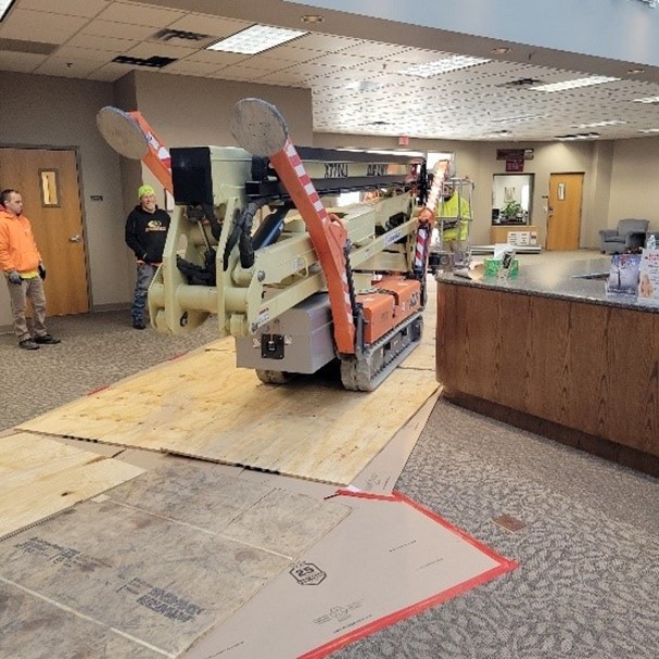 Photo shows the lift traveling through the reception area of the church.